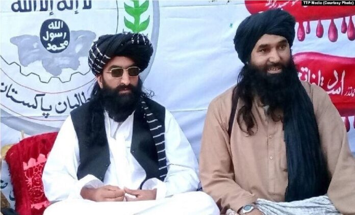 Tehrik-e Taliban Pakistan (TTP) chief Noor Wali Mehsud (left) with another movement leader in an undisclosed location